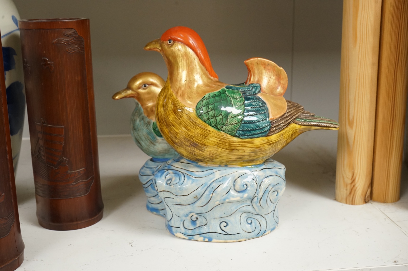 A Chinese Revolution Period porcelain bird group, 21.5cm, a pair of Chinese bamboo brushpots carved with figures and junks, each 22cm high, and a Japanese Seto blue and white vase, 29cm high